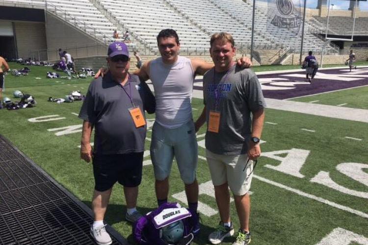 Roger, Mason and Brooks Barta stop for a photo after a K-State football practice in Manhattan last summer. (Courtesy Photo)