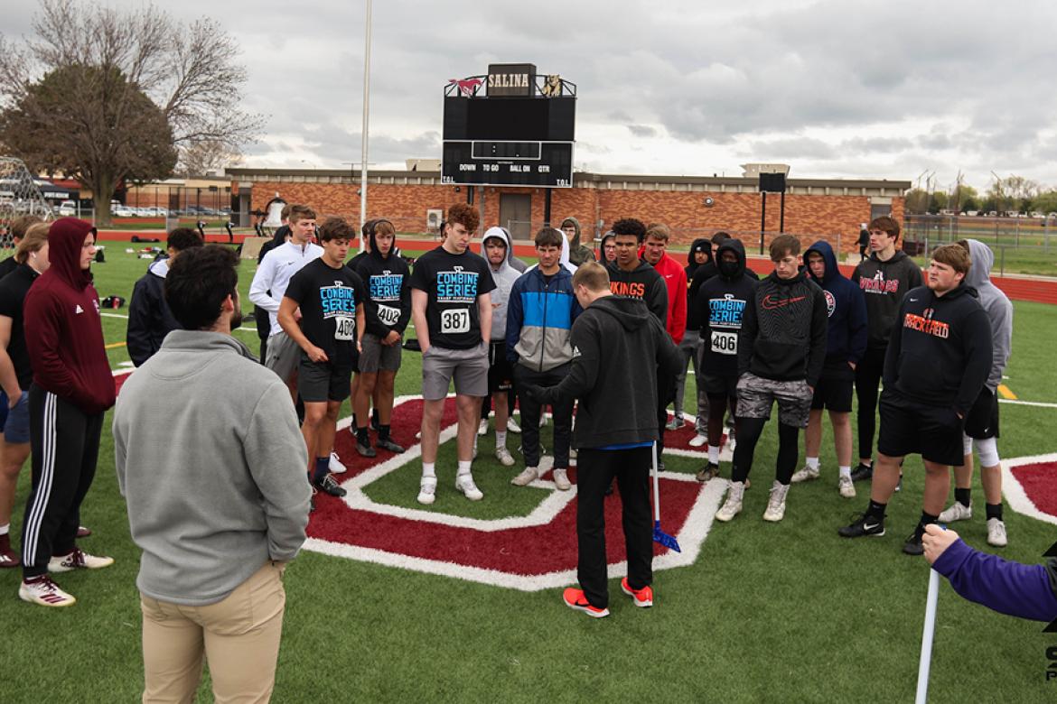Athletes receive instruction on how to complete the standing broad jump test at last Saturday's Sharp Performance Combine. (Photo by Rayne Schmidtberger)