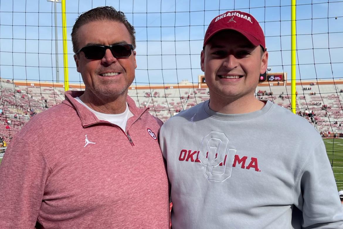 Cutline: John Kelly (right) stands with his father, Jim, at the University of Oklahoma's football stadium. (Courtesy Photo)
